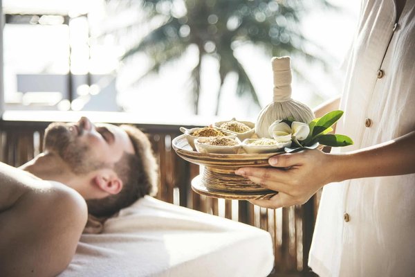 How can you create a luxurious en-suite bathroom in a UK master bedroom with limited space?